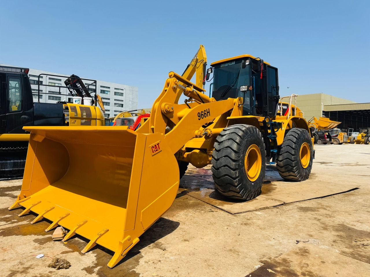 Caterpillar 966H wheel loader, rear three-quarter view